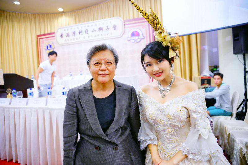 Harpist Lisa performs at a Lions event, with Rita Fan Hsu Lai-tai